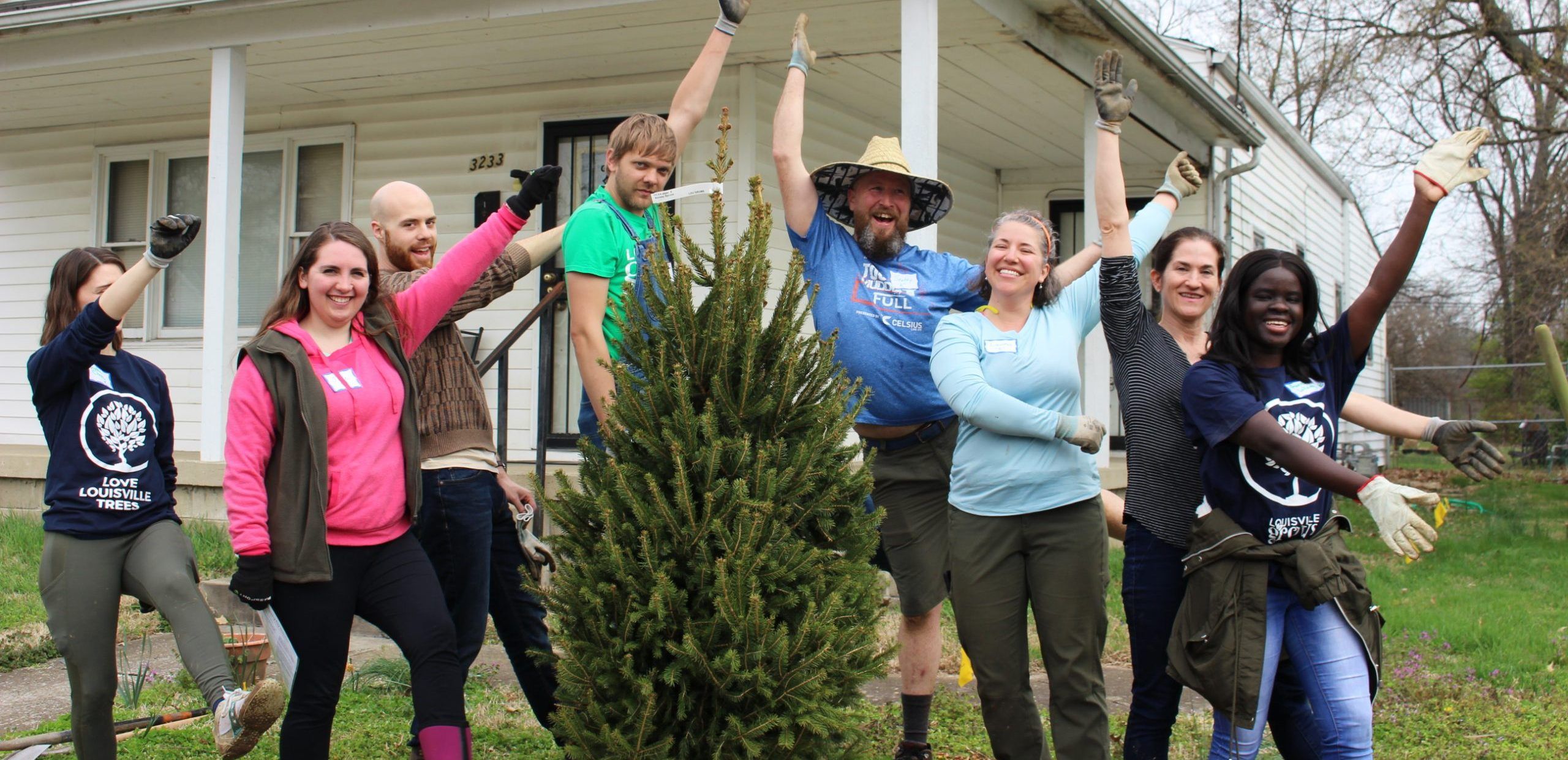Volunteers with a newly planted tree